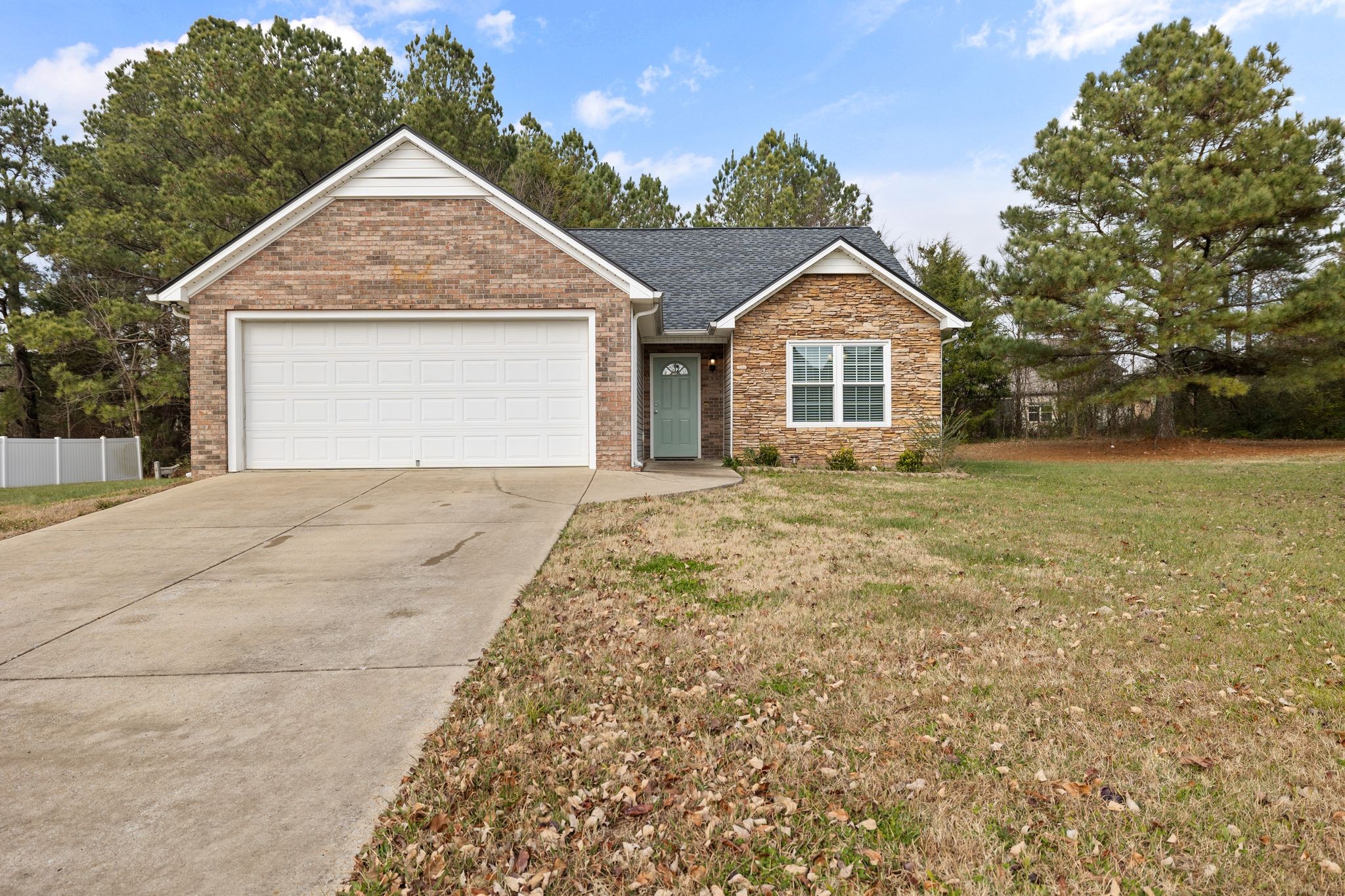 2041 Golden Court Spring Hill, TN 37174 - Photo 2 of 20 a front view of a house with a yard and garage