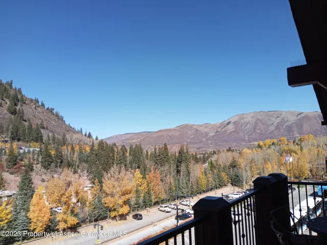 a view of a mountain from a balcony