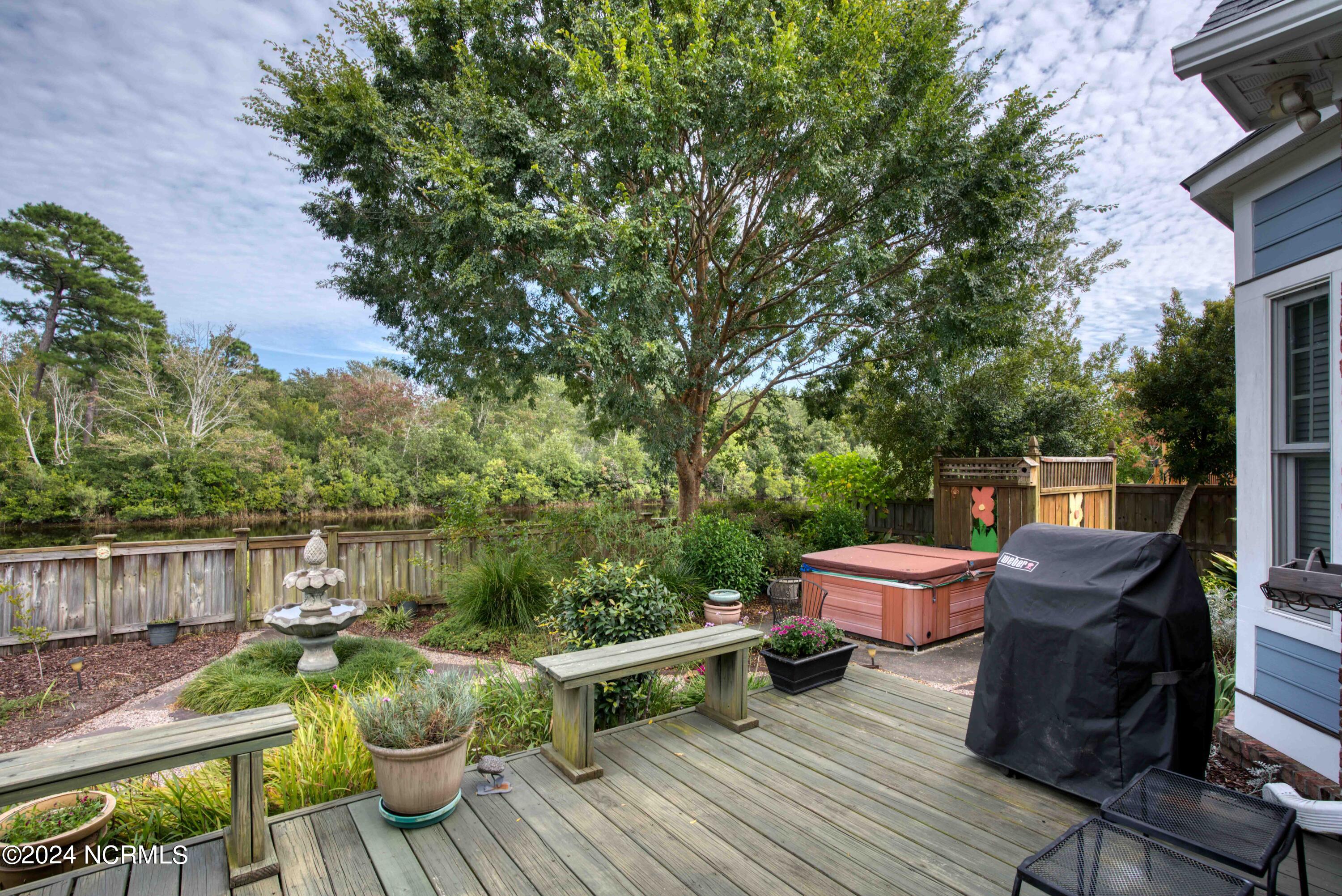562 Tanbridge Road Wilmington, NC 28405 - Photo 61 of 72 Colorful backyard with deck & stone patio