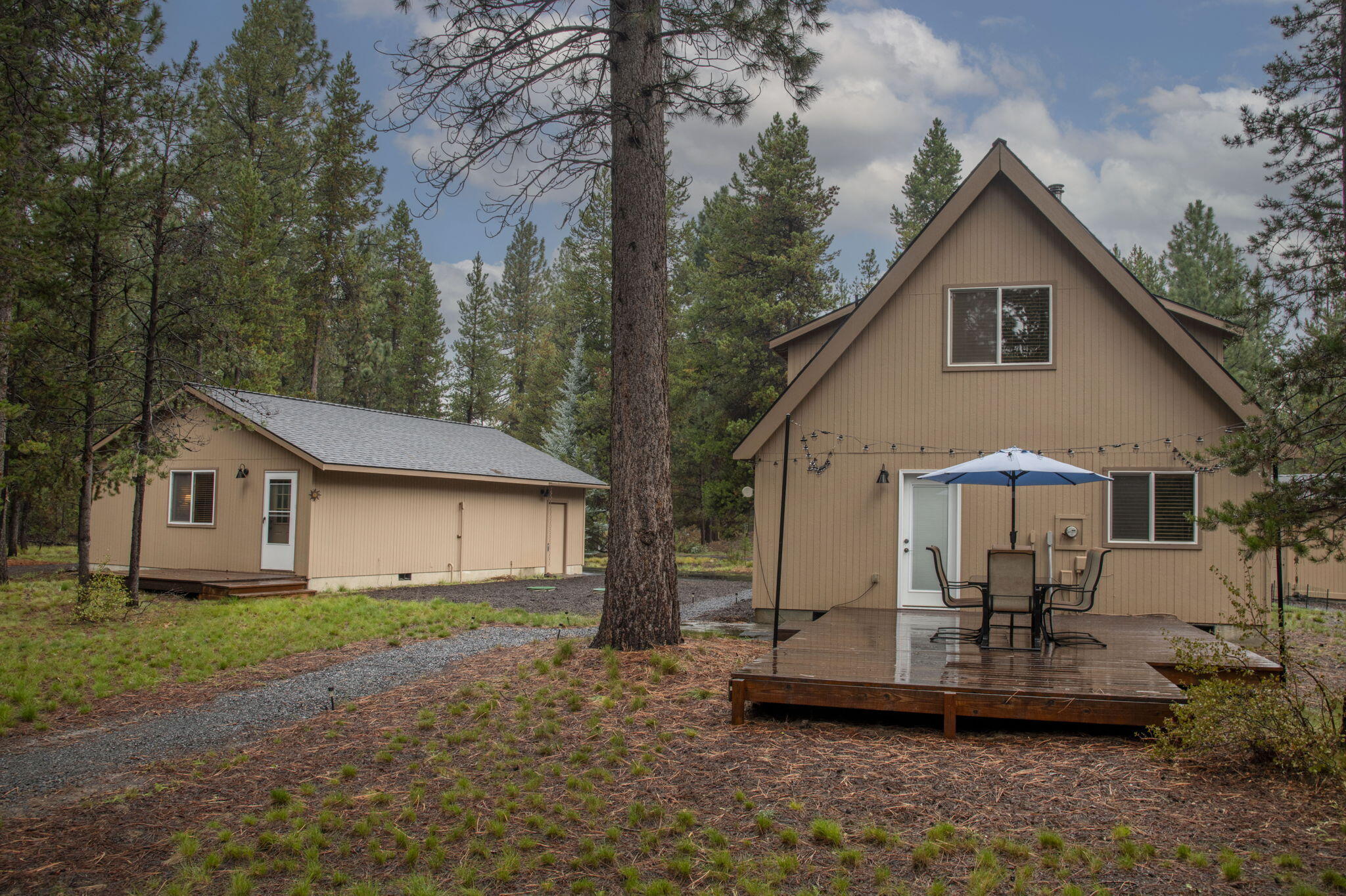 17225 Elsinore Road Bend, OR 97707 - Photo 25 of 27 View of the back decks- bunkhouse is to the left