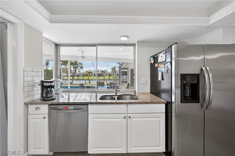 a kitchen with counter top space and appliances