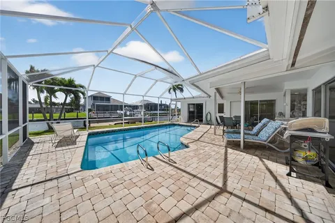 a view of a swimming pool with a lounge chair