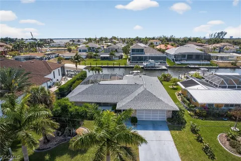 a aerial view of a house with a garden and plants