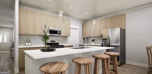a kitchen with kitchen island a sink appliances and cabinets
