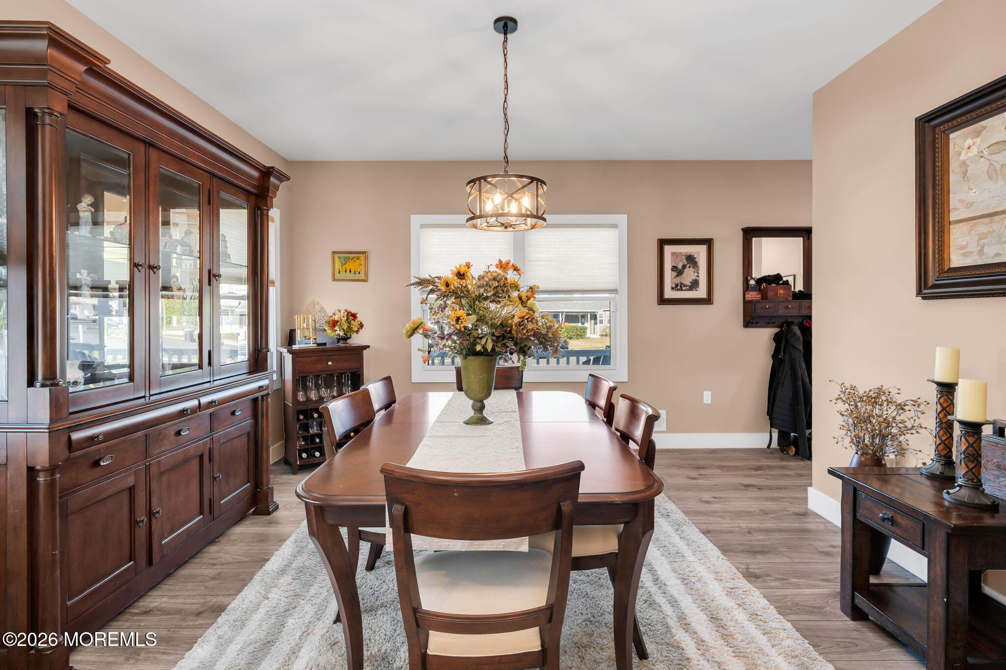 312 Elm Court Brick, NJ 08723 - Photo 12 of 57 a dining room with furniture a chandelier and wooden floor