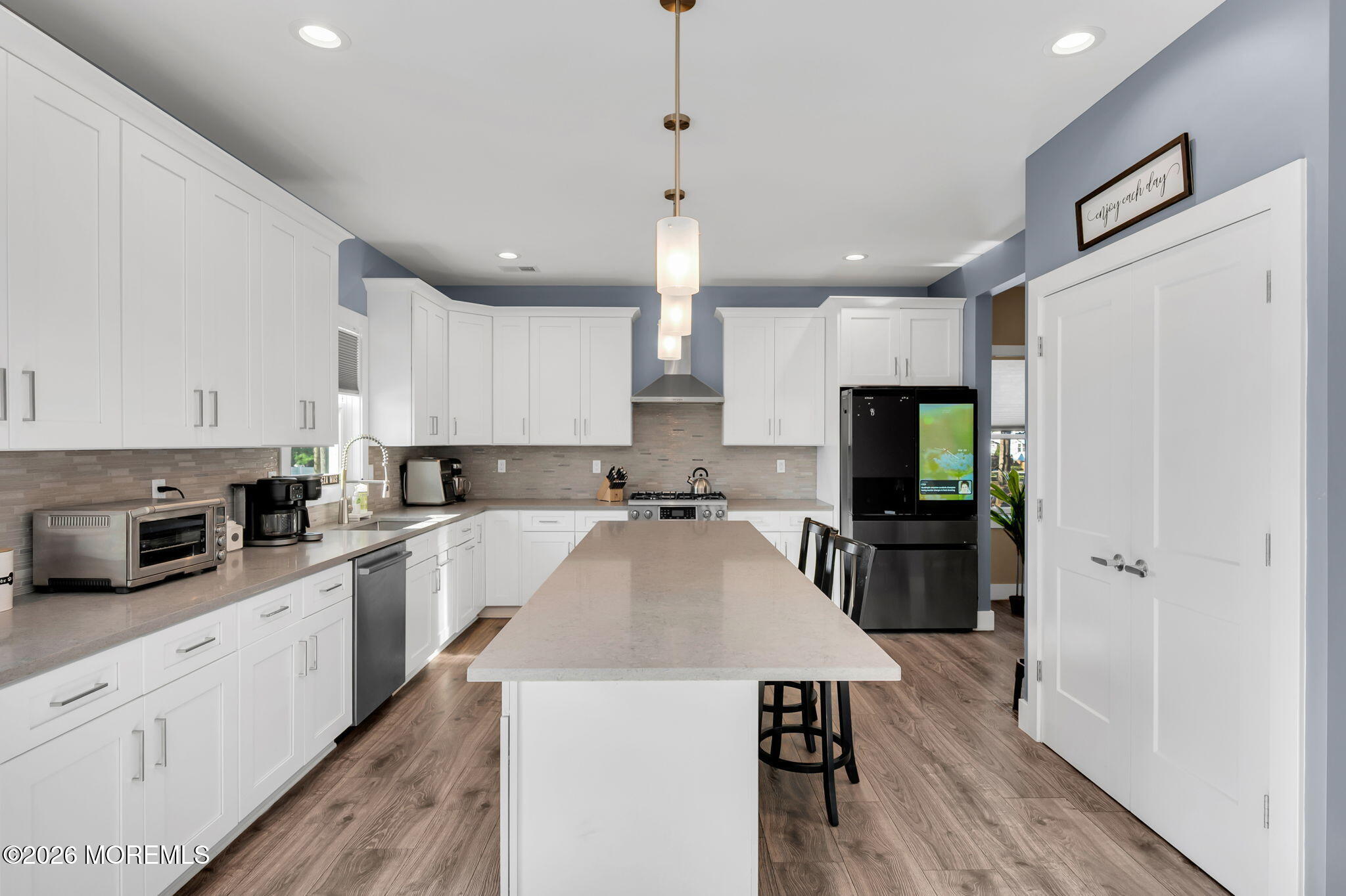 312 Elm Court Brick, NJ 08723 - Photo 21 of 57 a kitchen with a refrigerator a sink a stove a microwave and cabinets