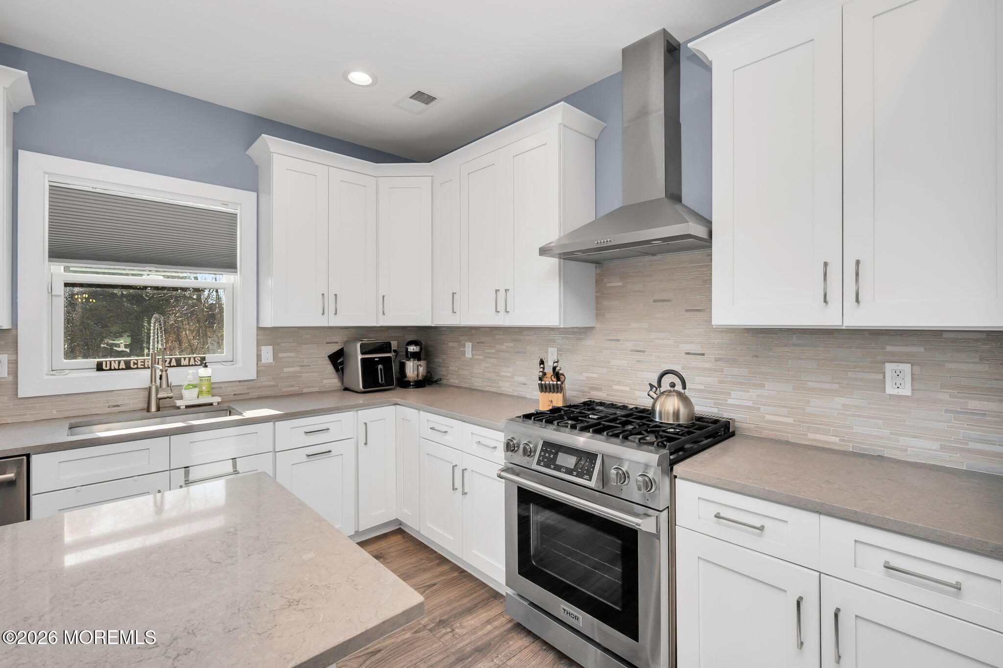 312 Elm Court Brick, NJ 08723 - Photo 25 of 57 a kitchen with stainless steel appliances granite countertop white cabinets and a stove