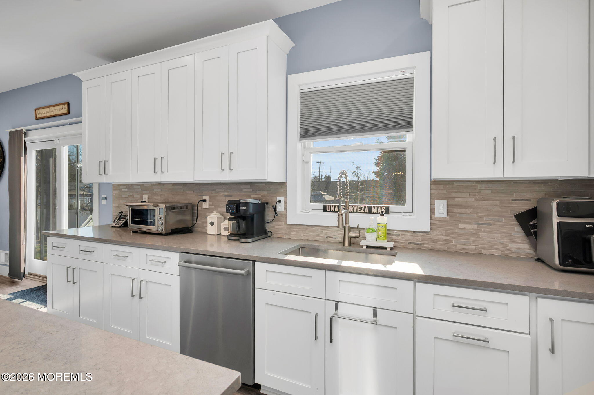 312 Elm Court Brick, NJ 08723 - Photo 26 of 57 a kitchen with granite countertop white cabinets white appliances and a sink