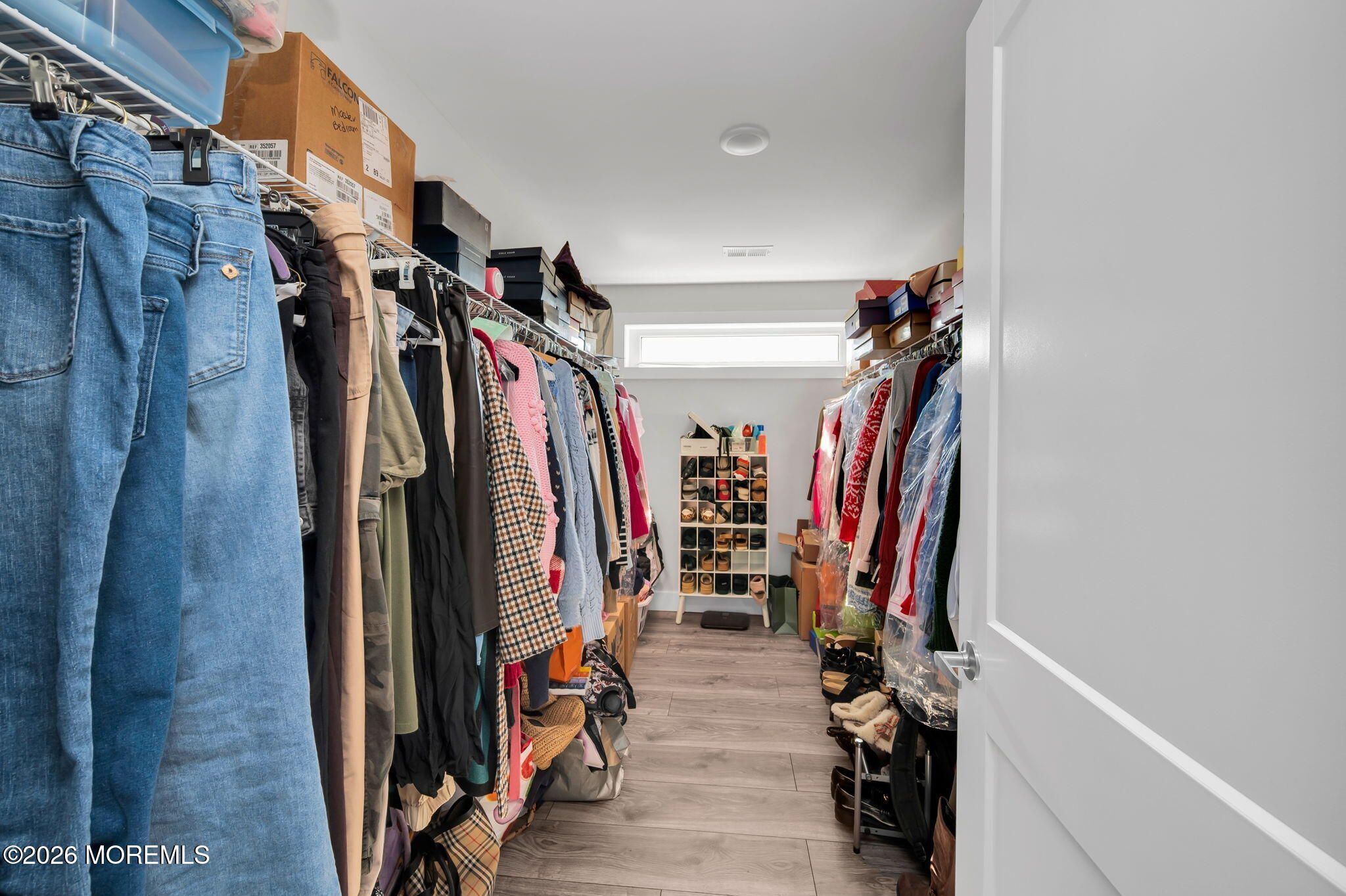 312 Elm Court Brick, NJ 08723 - Photo 34 of 57 a view of walk in closet with clothes
