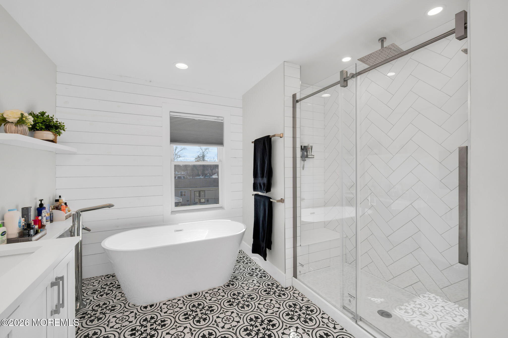 312 Elm Court Brick, NJ 08723 - Photo 38 of 57 a white bath tub sitting next to a white toilet and shower