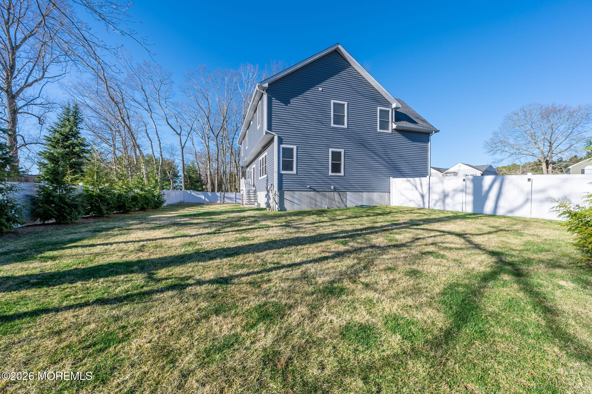 312 Elm Court Brick, NJ 08723 - Photo 55 of 57 a front view of a house with a yard