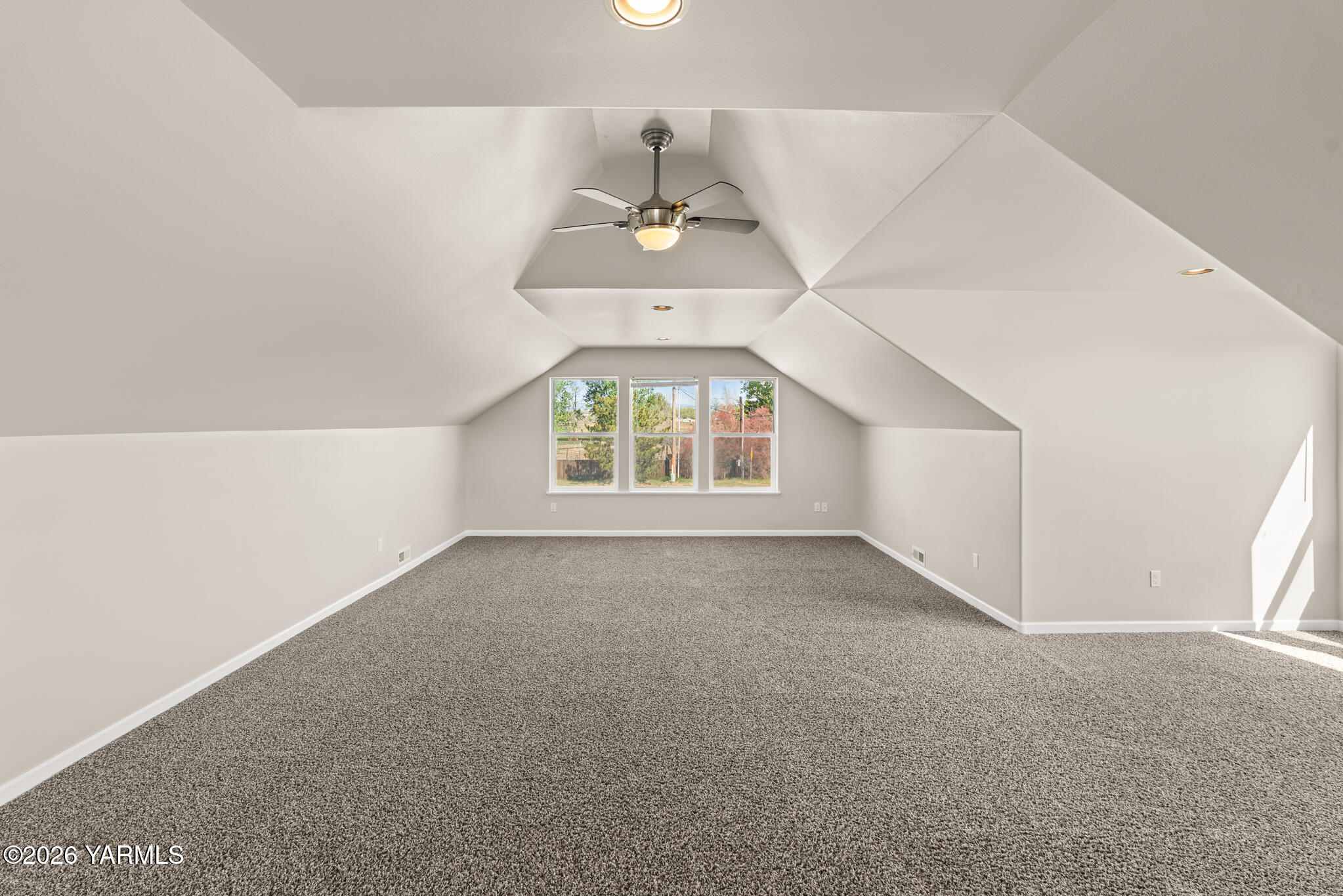 11625 Missimer Road Prosser, WA 99350 - Photo 35 of 40 an empty room with windows and chandelier fan