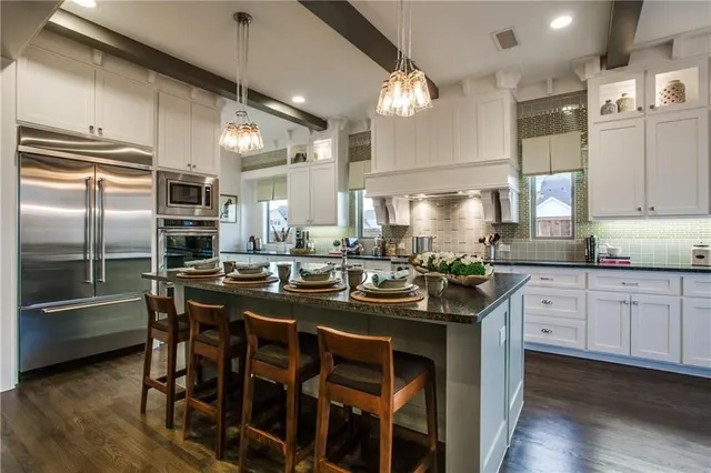 a kitchen with a sink stove and refrigerator