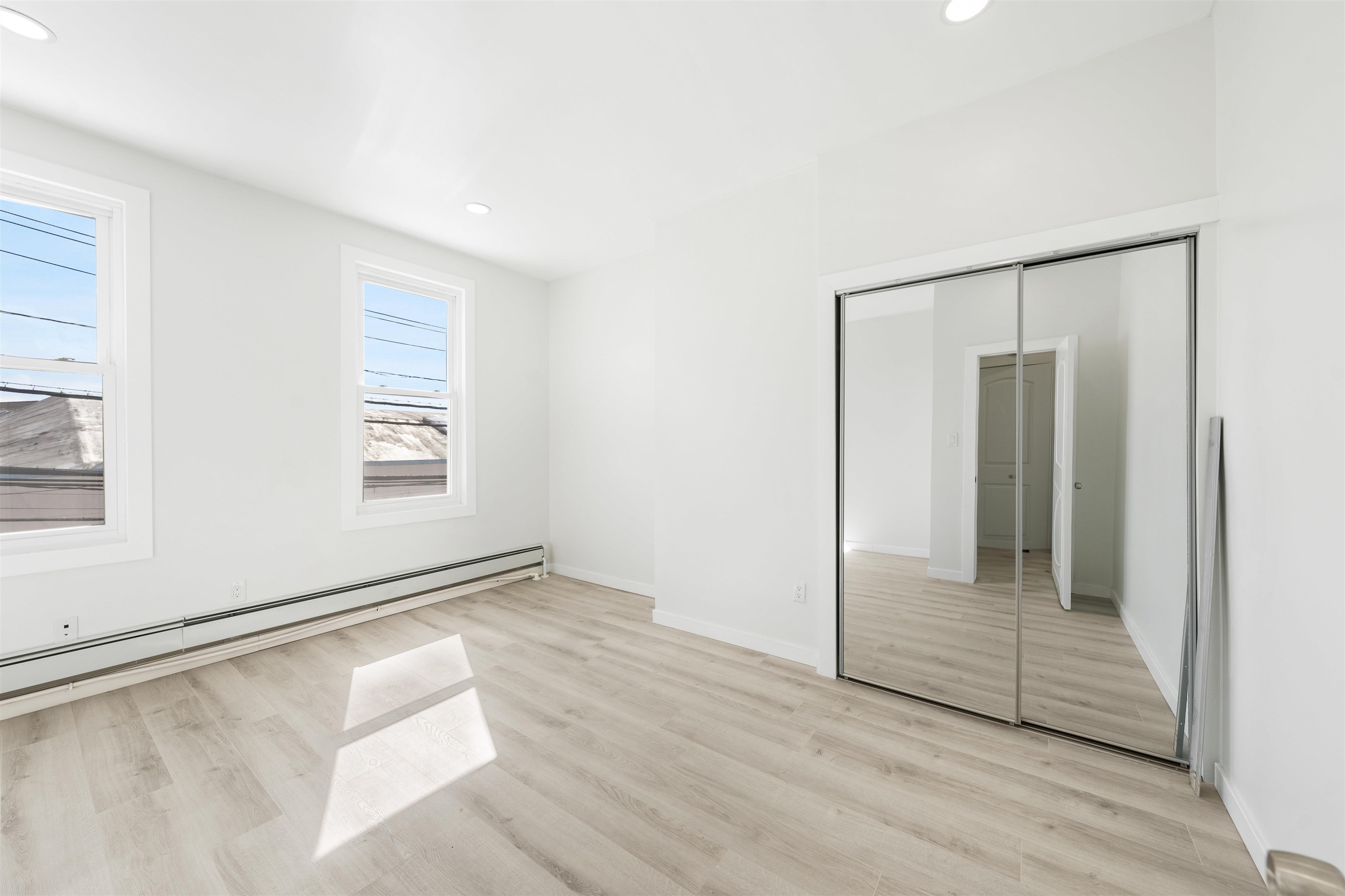 600 67th Street, Unit 2 West New York, NJ 07093 - Photo 9 of 13 a view of an empty room with glass door