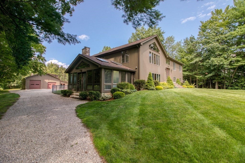 65 White Loaf Road Southampton, MA 01073 - Photo 15 of 33 a front view of a house with a yard and trees