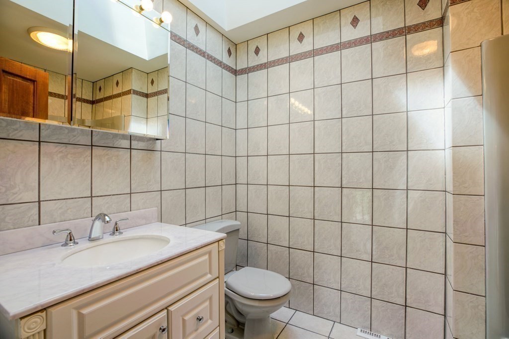 65 White Loaf Road Southampton, MA 01073 - Photo 20 of 33 a bathroom with a sink toilet and shower
