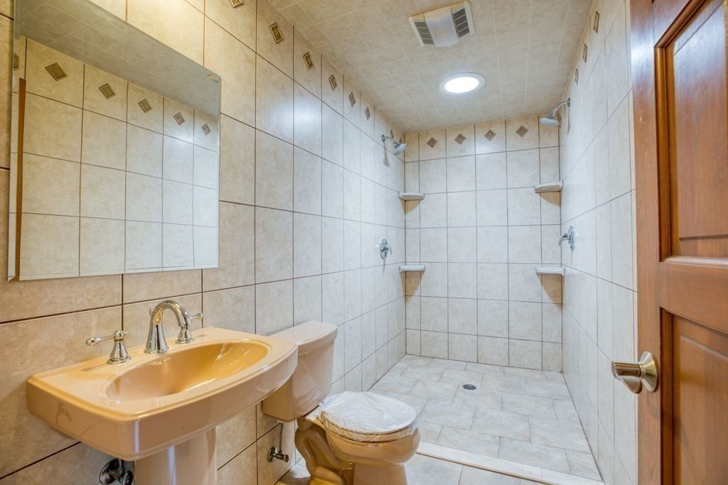 65 White Loaf Road Southampton, MA 01073 - Photo 24 of 33 a bathroom with a sink toilet and shower