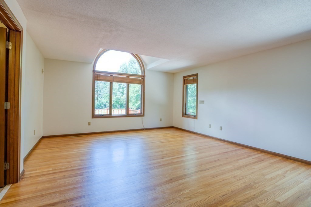 65 White Loaf Road Southampton, MA 01073 - Photo 25 of 33 an empty room with wooden floor and windows