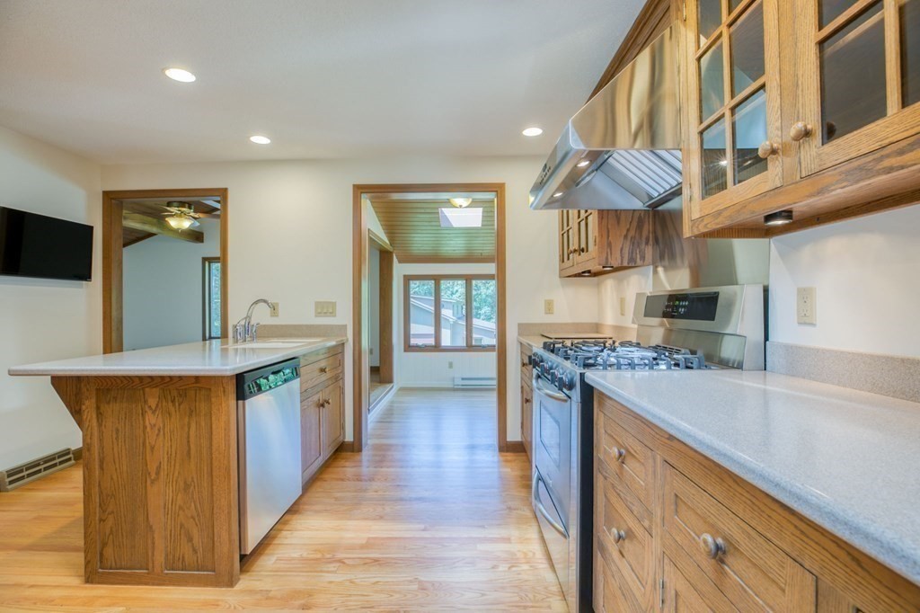 65 White Loaf Road Southampton, MA 01073 - Photo 9 of 33 a kitchen with stainless steel appliances granite countertop a stove and a sink