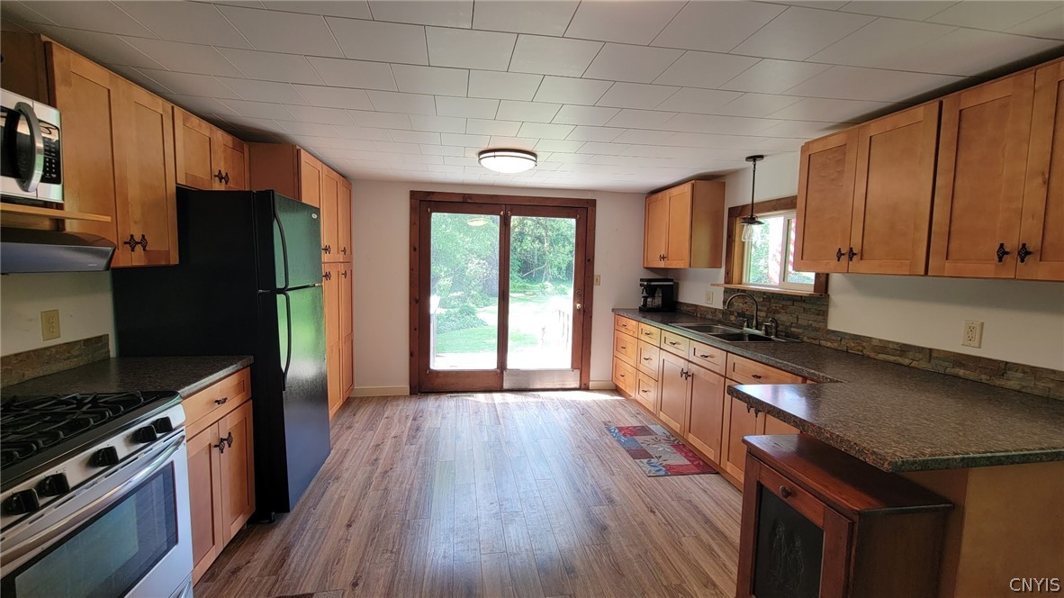 4524 Maybury Road Solon, NY 13101 - Photo 3 of 42 Kitchen/French door to small deck with stair to si