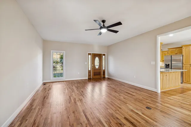 a view of a big room with closet and windows