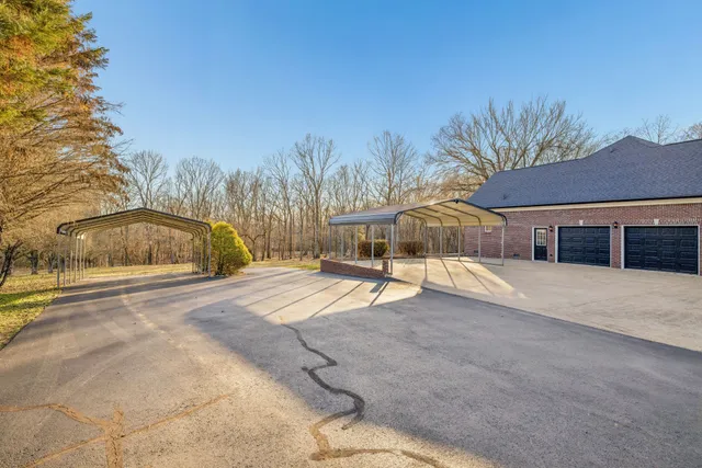 a kitchen with stainless steel appliances granite countertop a refrigerator and cabinets