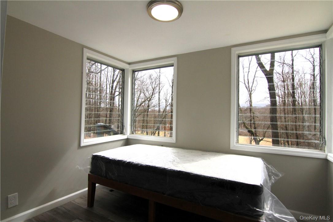 71 Miller Road, Unit 5 Hopewell Junction, NY 12533 - Photo 11 of 20 a bed sitting in a bedroom next to a window
