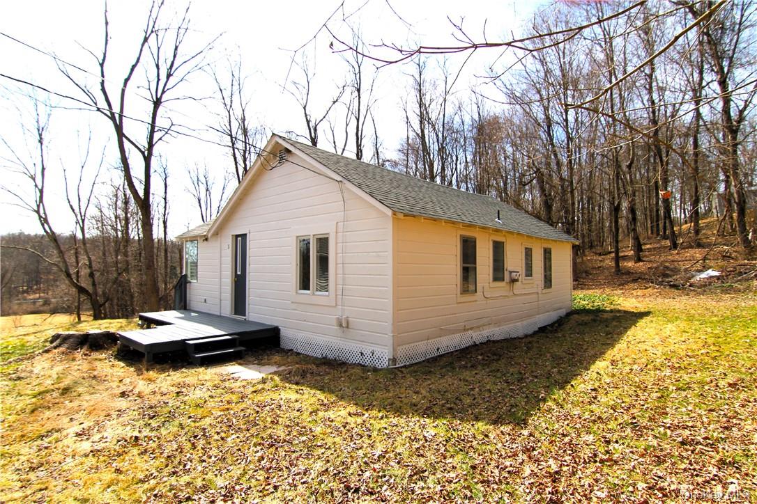 71 Miller Road, Unit 5 Hopewell Junction, NY 12533 - Photo 17 of 20 a view of a white house with a yard covered in snow