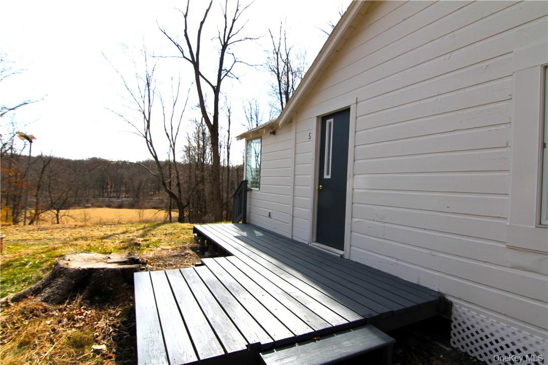 71 Miller Road, Unit 5 Hopewell Junction, NY 12533 - Photo 3 of 20 a view of a backyard of the house