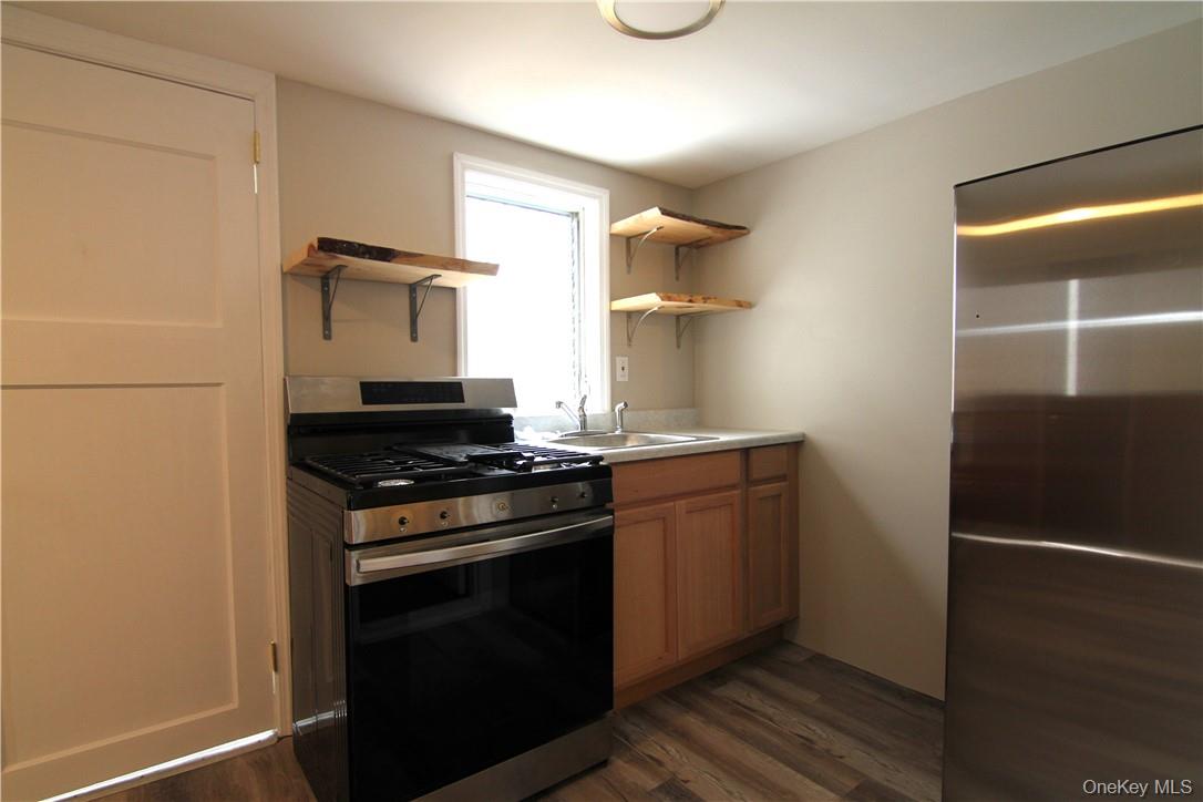 71 Miller Road, Unit 5 Hopewell Junction, NY 12533 - Photo 6 of 20 a stove top oven sitting inside of a kitchen
