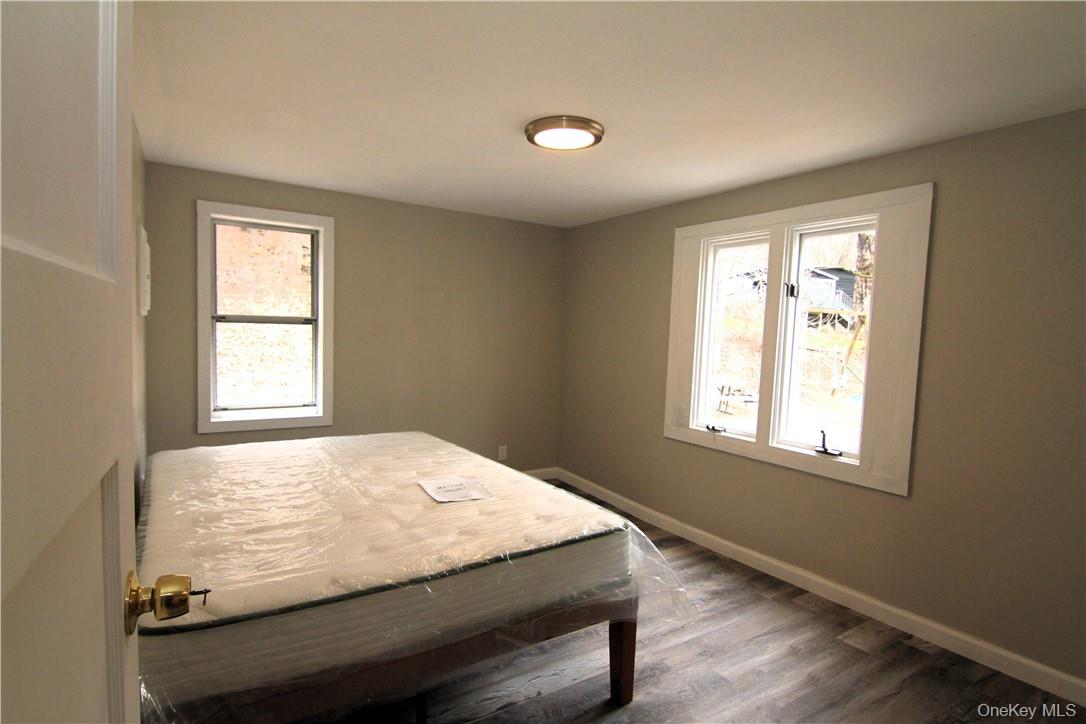 71 Miller Road, Unit 5 Hopewell Junction, NY 12533 - Photo 7 of 20 a bed sitting in a bedroom next to a window