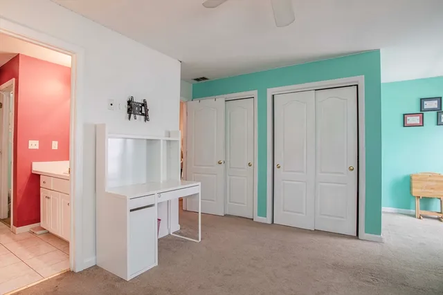 a room with furniture and a refrigerator