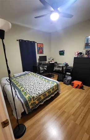 a bedroom with a bed and dresser