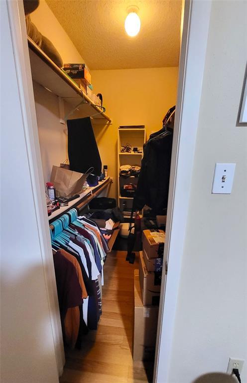 114 East 31st Street, Unit 201 Austin, TX 78705 - Photo 8 of 11 a view of walk in closet with clothes and shoes