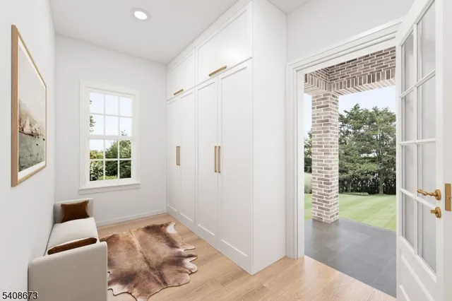 a view of a bedroom with a bed and a window