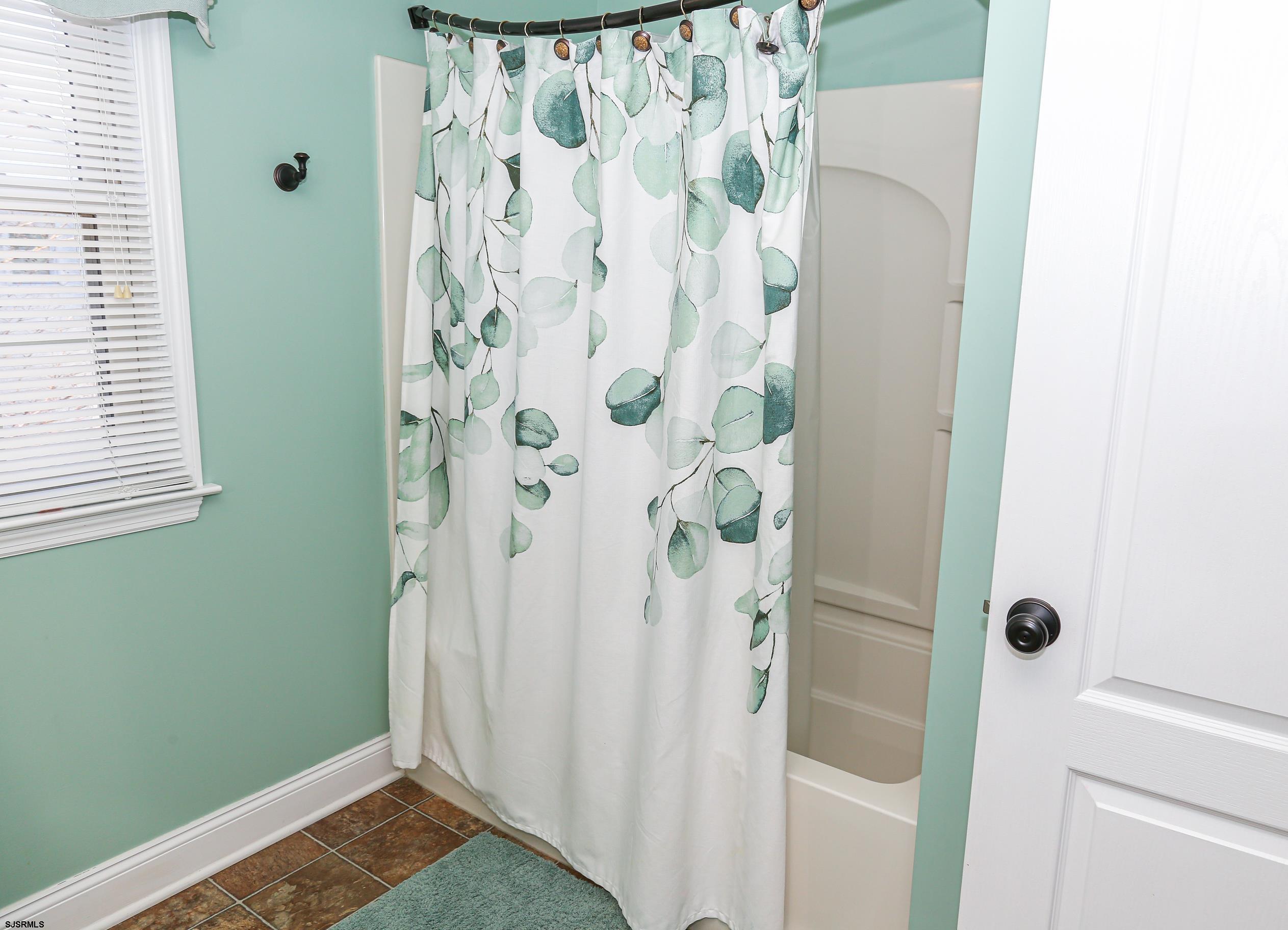 5216 Waterview Drive Brigantine, NJ 08203 - Photo 11 of 57 a view of bathroom with a shower and curtain