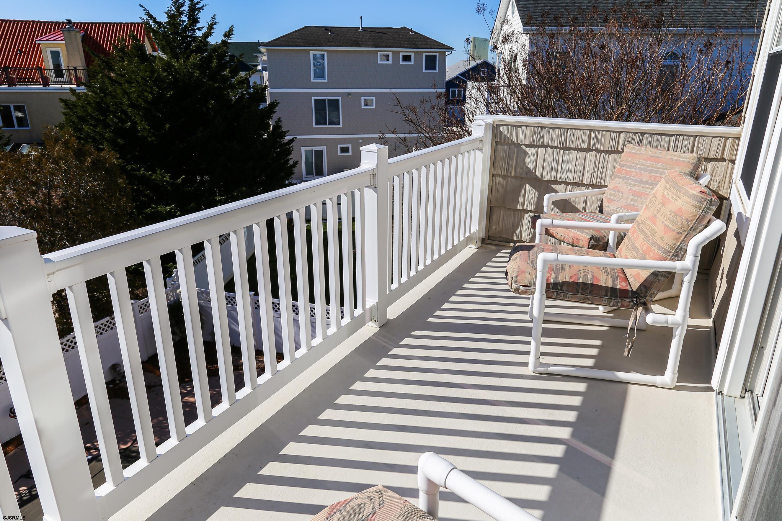 5216 Waterview Drive Brigantine, NJ 08203 - Photo 16 of 57 a view of a balcony with wooden floor