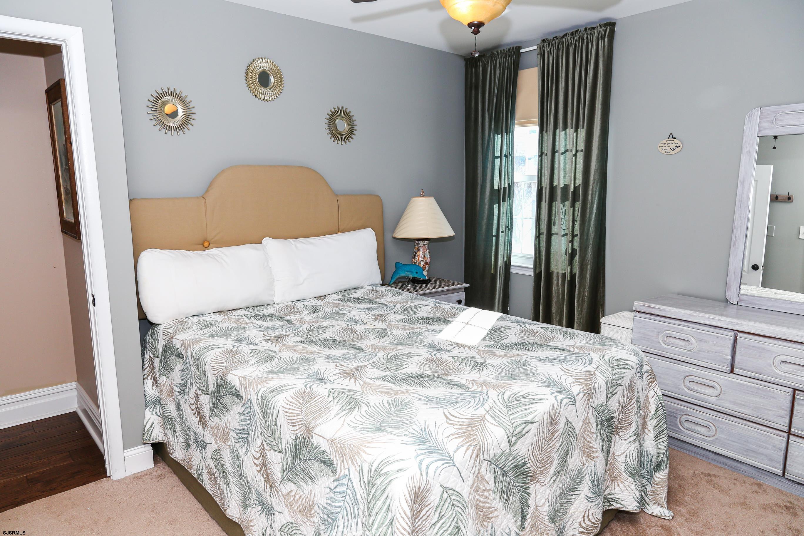 5216 Waterview Drive Brigantine, NJ 08203 - Photo 52 of 57 a bedroom with a bed and a window
