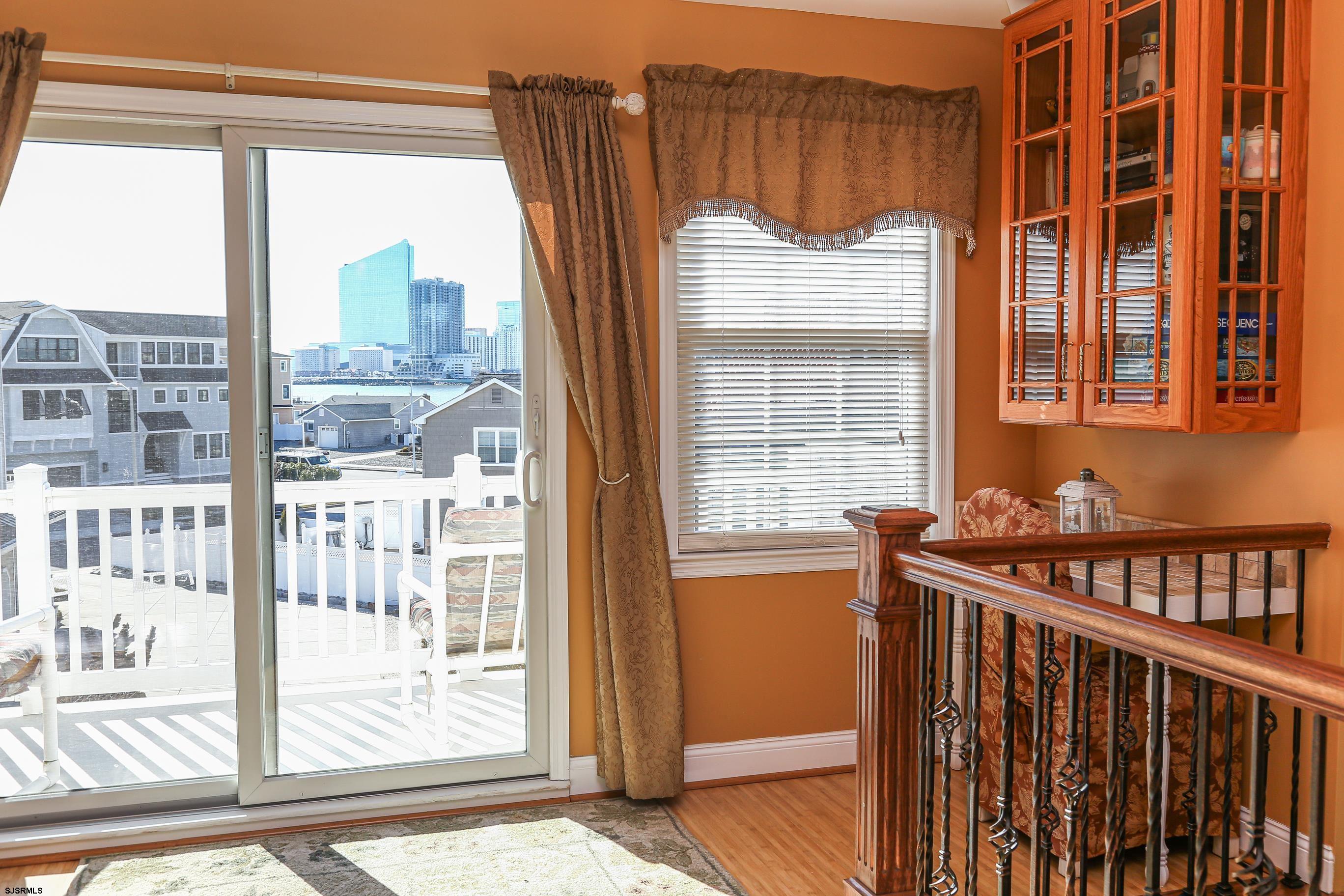 5216 Waterview Drive Brigantine, NJ 08203 - Photo 56 of 57 a view of a porch with a table and chairs