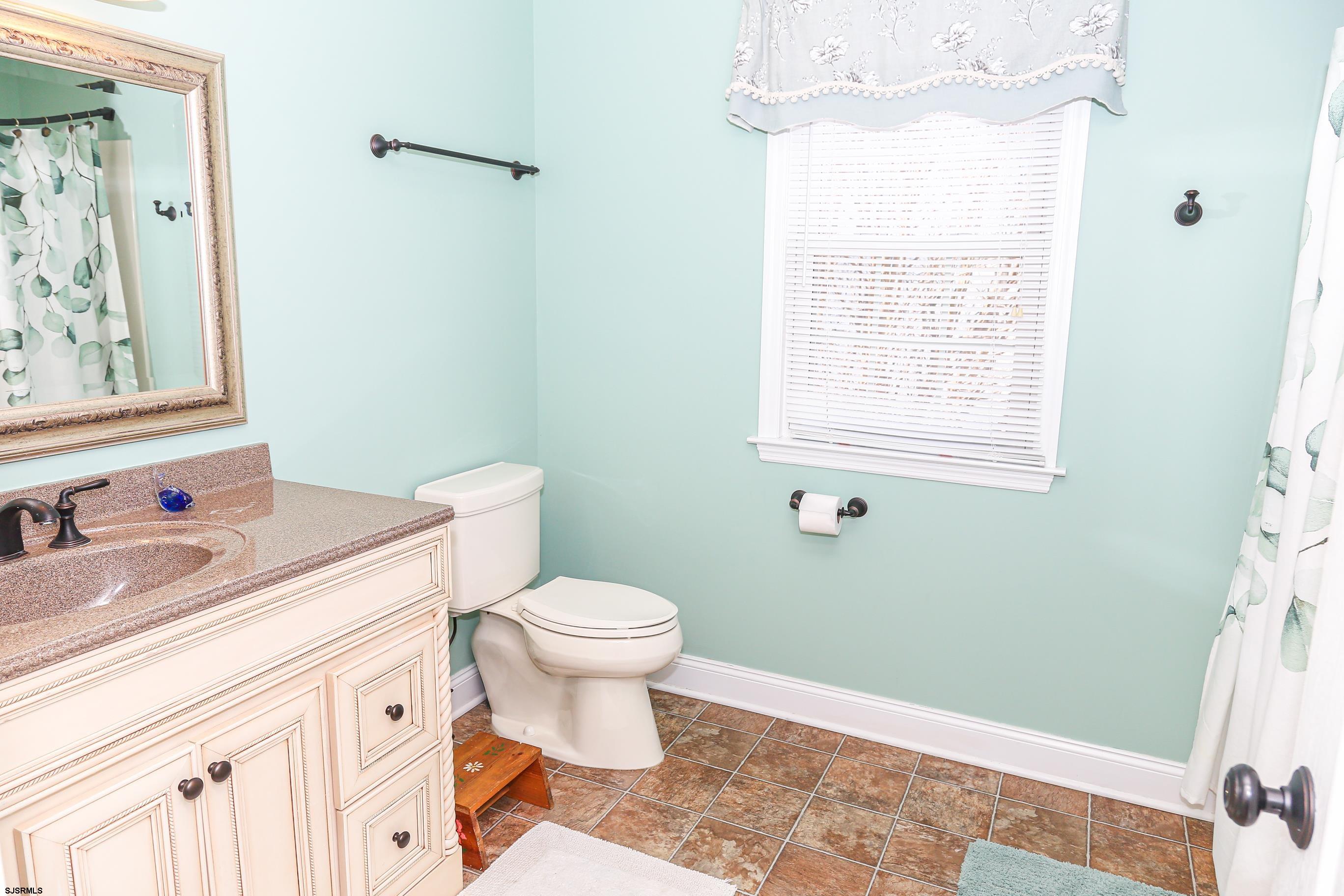 5216 Waterview Drive Brigantine, NJ 08203 - Photo 10 of 57 a bathroom with a sink toilet and shower