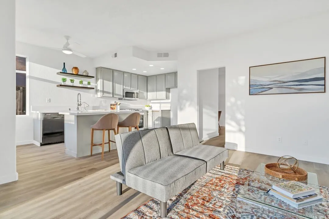 1518 Corte Roberto Oceanside, CA 92056 - Photo 11 of 41 a living room with stainless steel appliances furniture and a wooden floor