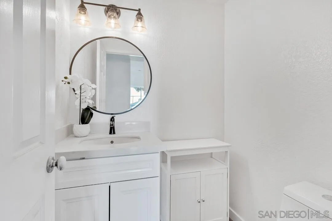 1518 Corte Roberto Oceanside, CA 92056 - Photo 12 of 41 a close view of a sink and a mirror