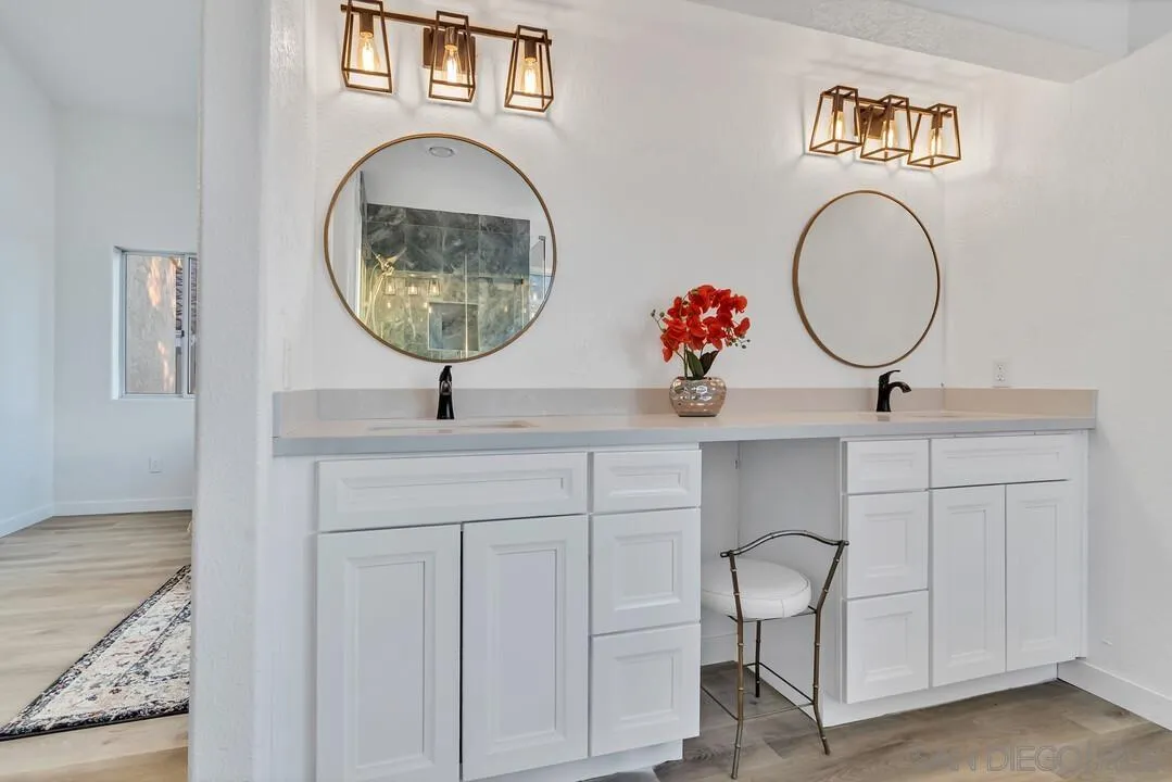 1518 Corte Roberto Oceanside, CA 92056 - Photo 20 of 41 a bathroom with a sink and a mirror