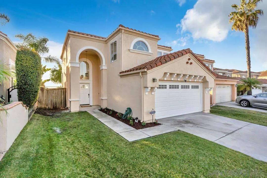 1518 Corte Roberto Oceanside, CA 92056 - Photo 2 of 41 a front view of a house with a yard
