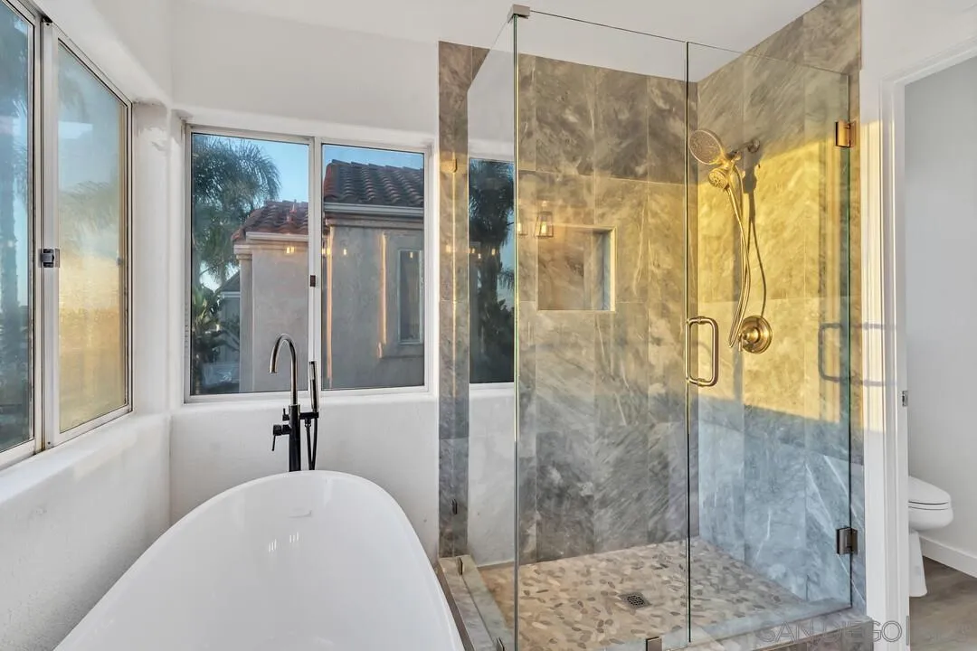 1518 Corte Roberto Oceanside, CA 92056 - Photo 22 of 41 a bathroom with a shower and a sink