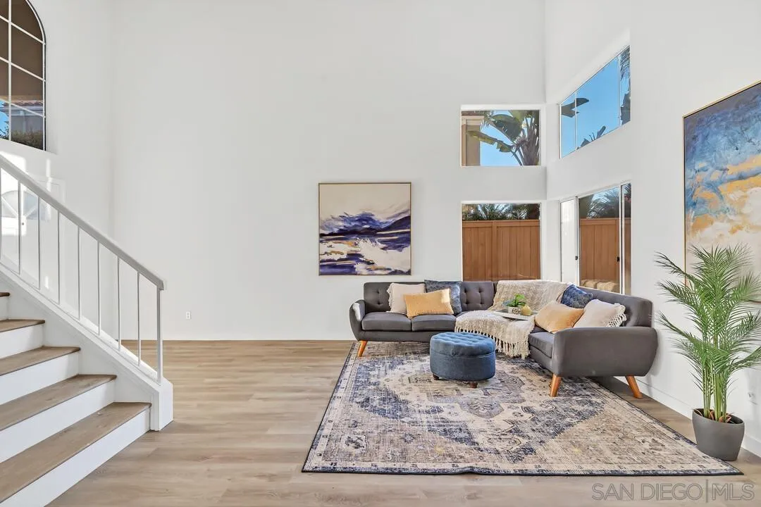 1518 Corte Roberto Oceanside, CA 92056 - Photo 3 of 41 a living room with furniture kitchen view and a rug