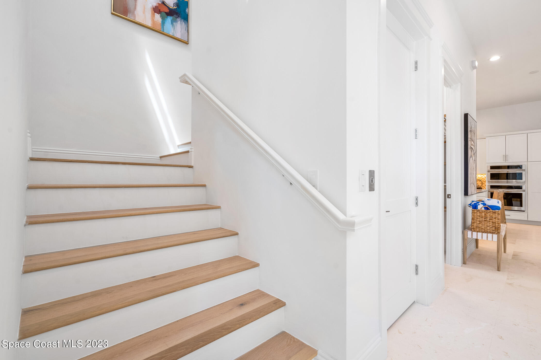 Undisclosed Address Vero Beach, FL 32963 - Photo 18 of 36 a view of entryway and hall with wooden floor