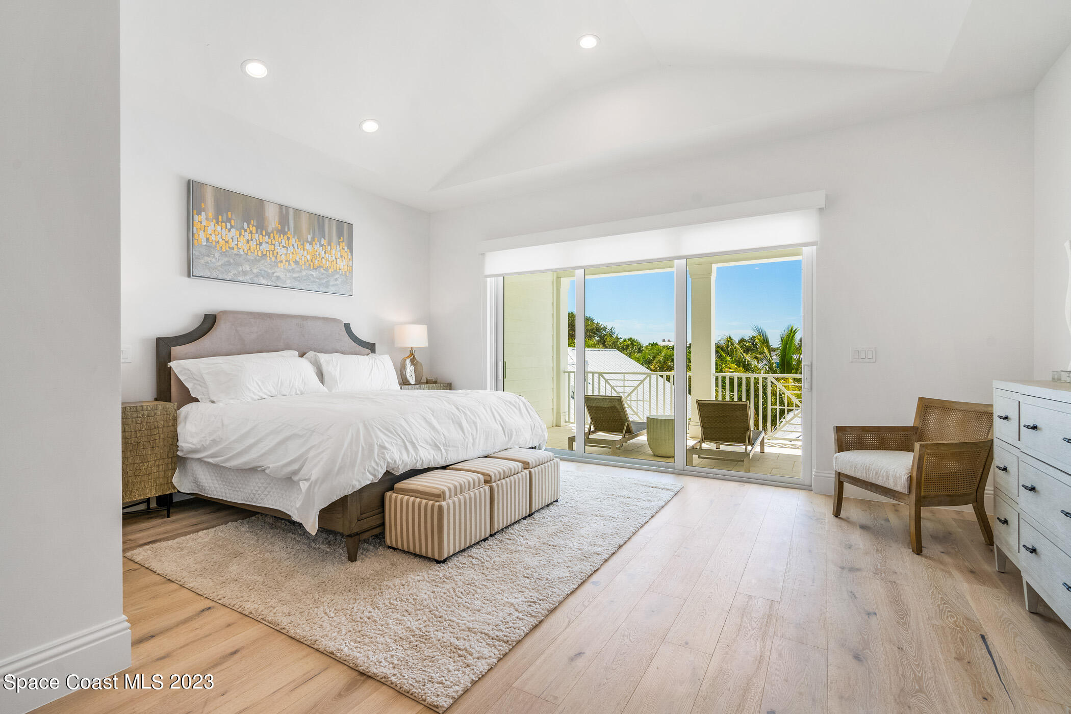 Undisclosed Address Vero Beach, FL 32963 - Photo 20 of 36 a spacious bedroom with a bed a table and a potted plant