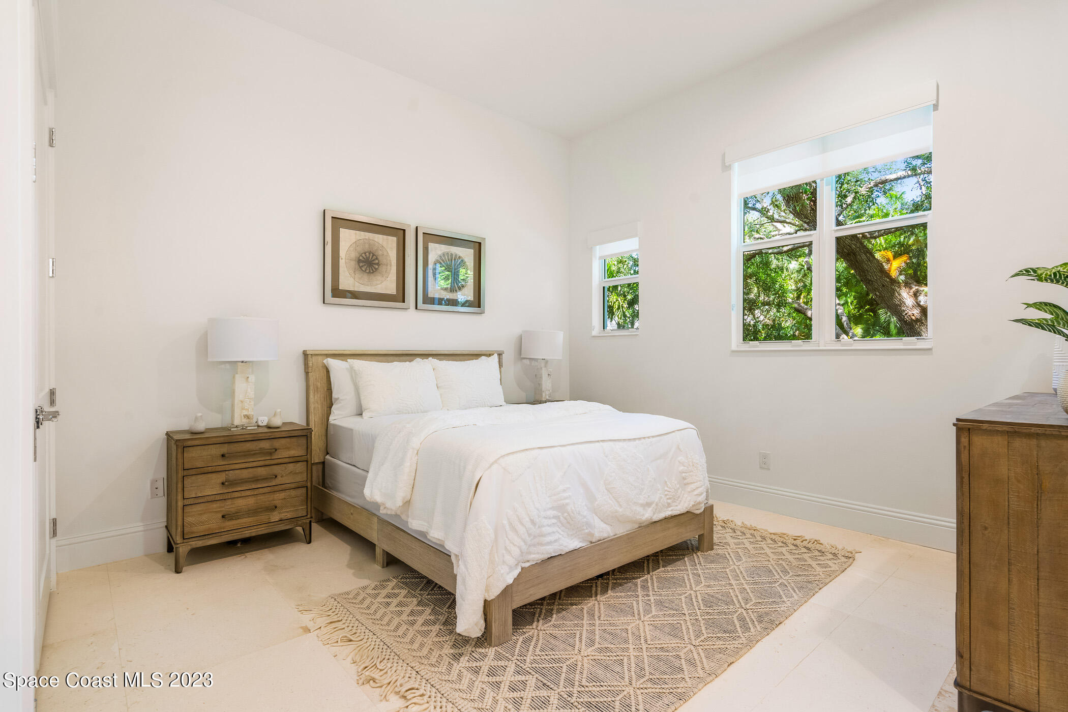 Undisclosed Address Vero Beach, FL 32963 - Photo 28 of 36 a bedroom with a bed and a painting on the wall