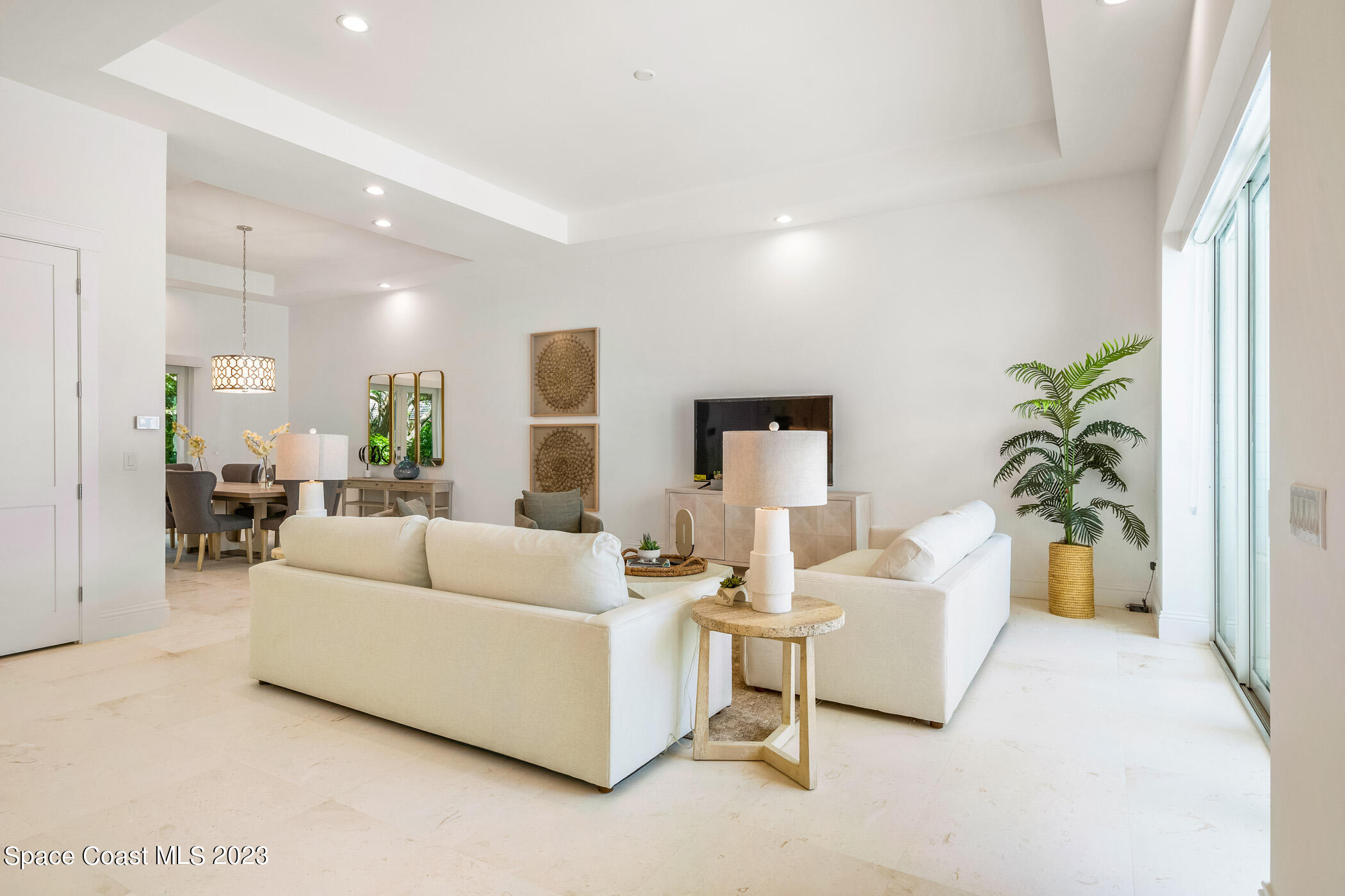 Undisclosed Address Vero Beach, FL 32963 - Photo 4 of 36 a living room with furniture and a potted plant